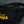 Black 7 Panel Trucker Hat - Yellow Logo