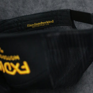 Black 7 Panel Trucker Hat - Yellow Logo